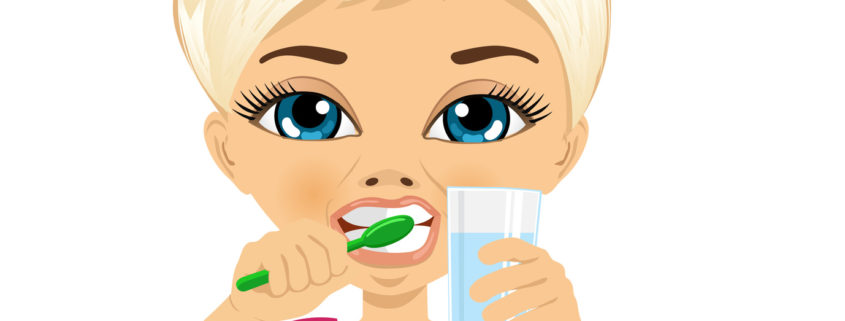 Cute little girl brushing teeth